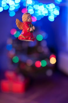 Christmas toy (angel) hanging and light ornament background