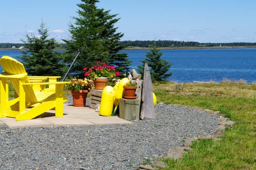 Yellow Lawn Chairs in a front yard over looking the harbour
