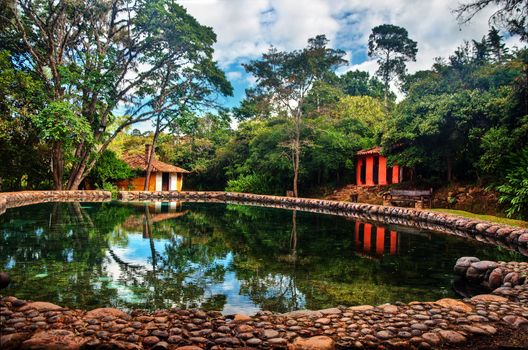 A natural swimming pool and colonial style buildings in Villa de Leyva, Colombia.