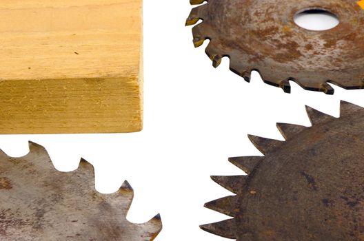 three circular saw disks parts with different blades and plank wooden board closeup isolated on white bakcgound
