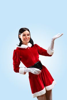 Santa Girl presenting your product, in costume and white gloves