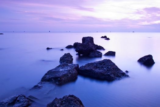 Beautiful seascape. Sea and rock at the sunset