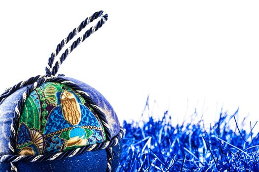 Italy. Traditional handmade Christmas ball made of white and blue fabric