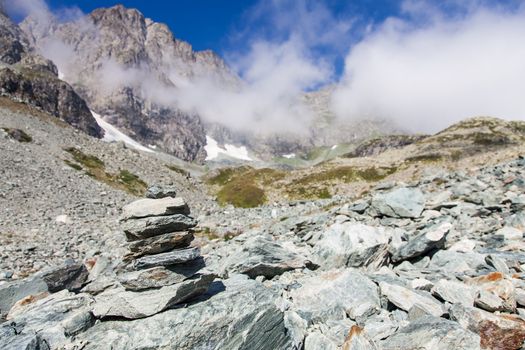 Italy, Monviso mountain. A path sign close to the top of one of the most scenic mountain of Alps.