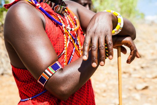 Kenya. Detail of the traditional Masai red costume.