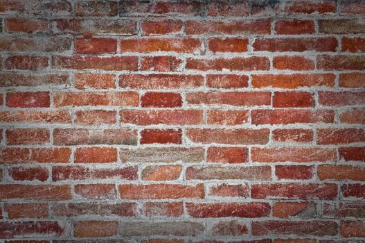 Orange old brick textured wall detail view