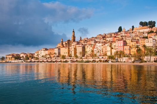 Menton Provence village houses sunrise with water reflections, France