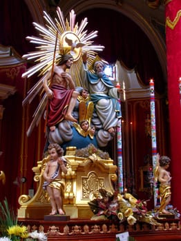 A statue representing The Holy Trinity on display in Marsa, Malta.