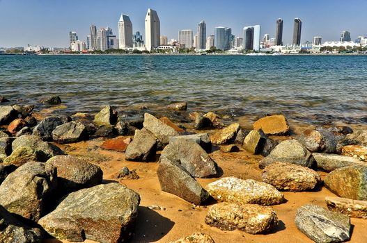 San Diego city view with rocks and water foreground, USA