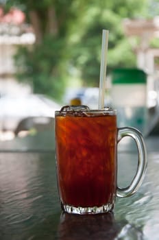 cold drink iced black tea in glass on table