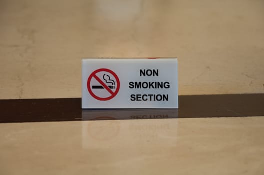 non smoking section sign on table