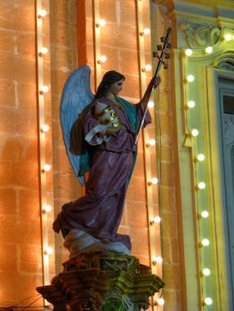 A papier mache angel being part of various street decorations for the feast of Saint Joseph in Ghaxaq, Malta.