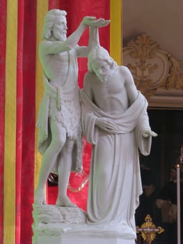 A marble statue portraying The Baptism of Jesus in Luqa, Malta.