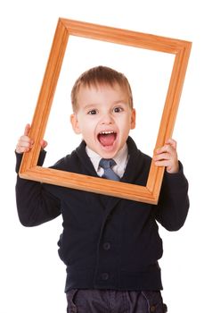 Shouting caucasian boy, holding a wooden picture frame. Isolated on white background 