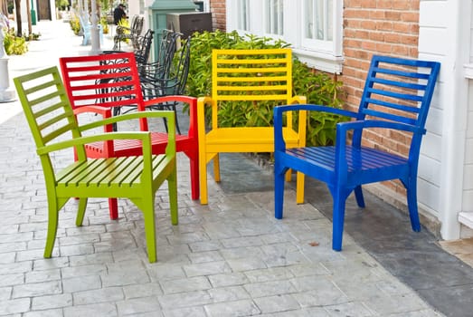 Colorful wooden chairs on various background, can be use for background or prints