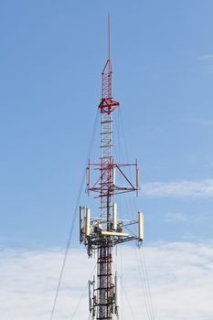 Communication tower over a blue sky background