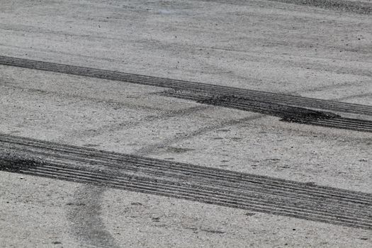 Background with tire marks on road track