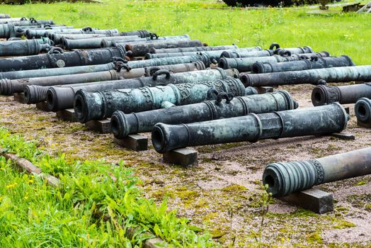 Old vintage Russian artillery systems and equipment on green grass taken on a sunny day, can be use for various military purposes