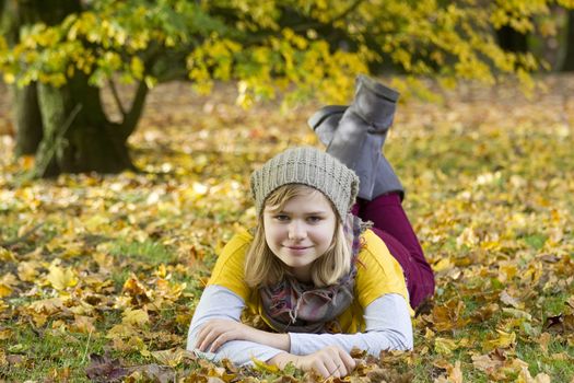 cute little girl in the autumn park 