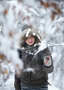 Woman in the deep winter forest