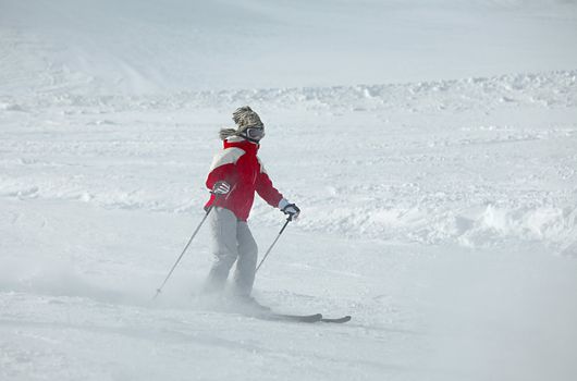 Skier rushing down the slope