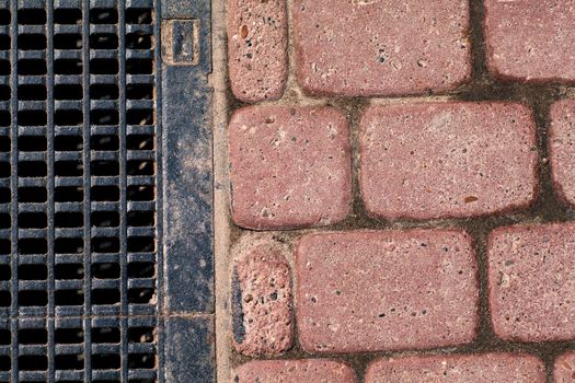 Paving blocks and gutter on a road