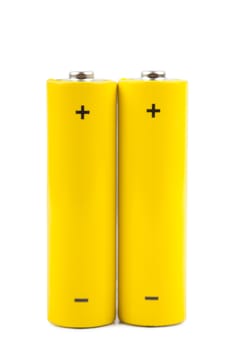 Two yellow batteries isolated over white background