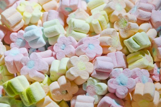 Multicolor flower-shaped marshmallows served at a children's party