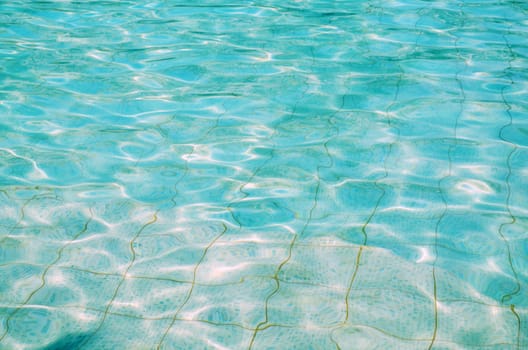 Ripples of clear, turquoise pool water
