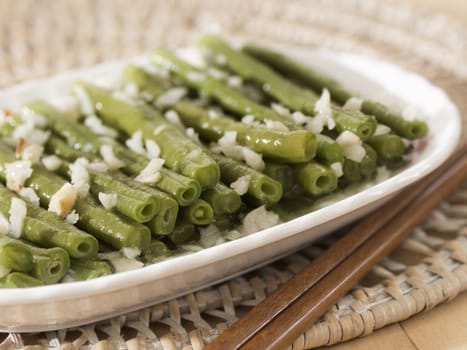 close up of a plate of stir fried long beans