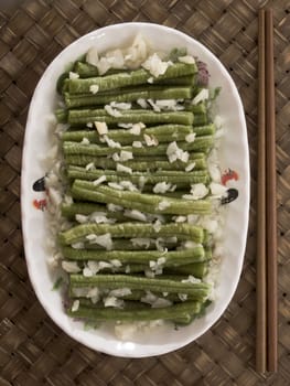 close up of a plate of stir fried long beans