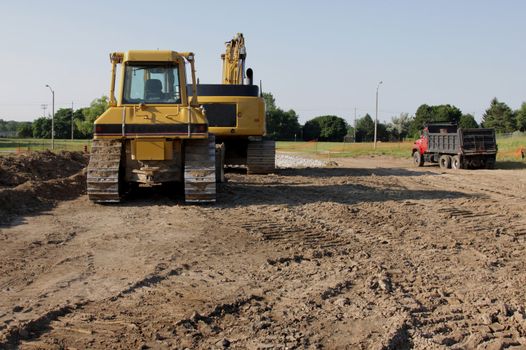 Construction Vehicles at fresh construction site.
