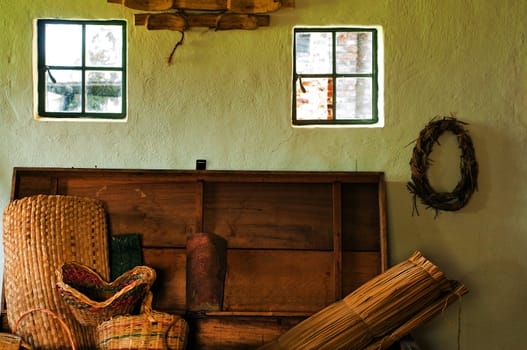 An interior shot of a colonial with wicker baskets and other decoration.