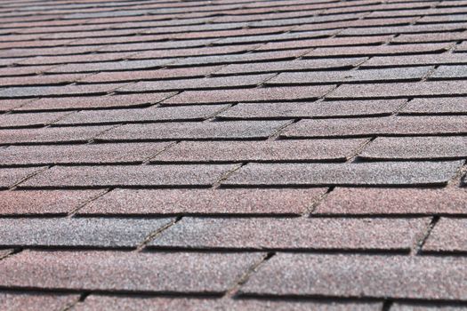Close up view of roof shingles on a newly shingled roof.