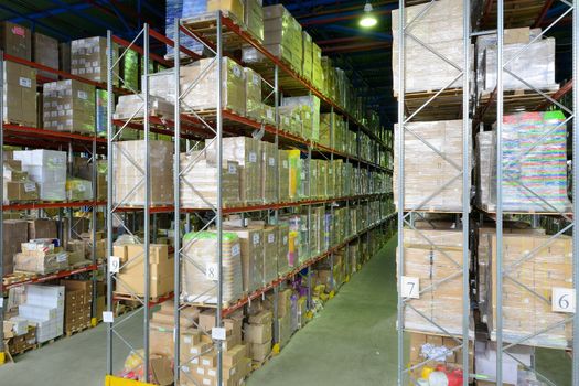 Indoor warehouse with lot of pallet. Wide angle photo.