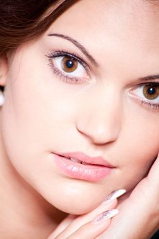 beautiful brunette woman portrait with makeup and brown eyes