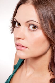 beautiful brunette woman portrait with makeup and brown eyes