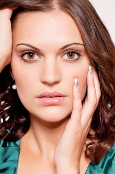 beautiful brunette woman portrait with makeup and brown eyes