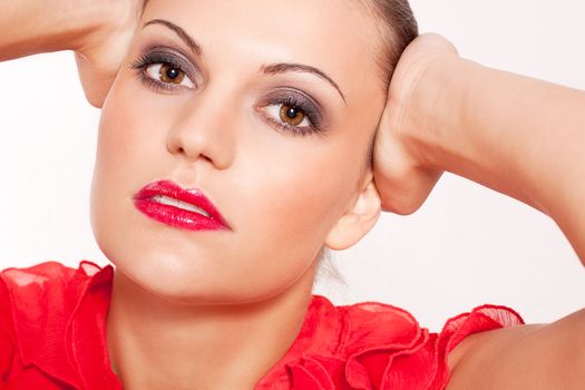 beautiful brunette woman with red lips and red shirt