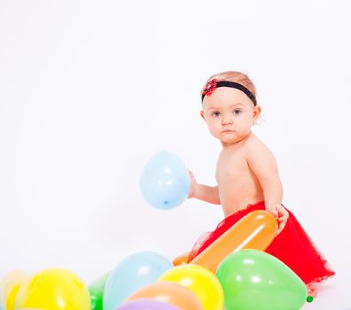 cute little baby child with colorfull balloons birthday celebration