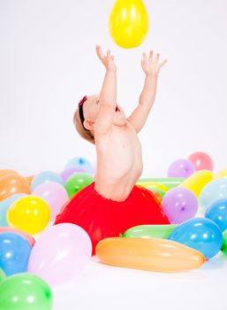 cute little baby child with colorfull balloons birthday celebration