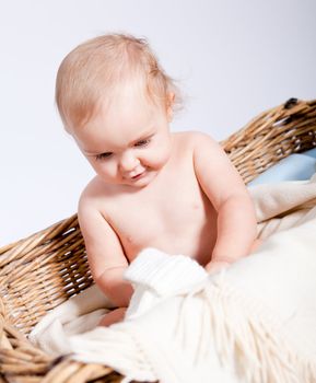 cute little baby infant in basket with white teddy bear