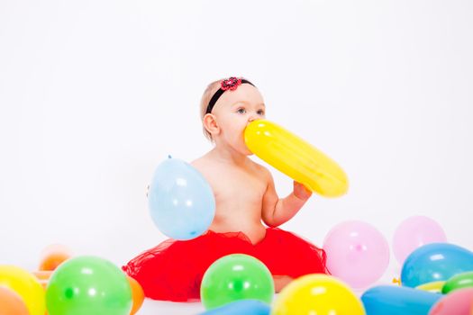 cute little baby child with colorfull balloons birthday celebration