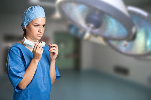 Young female surgeon getting ready for a surgery