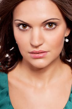 beautiful brunette woman portrait with makeup and brown eyes