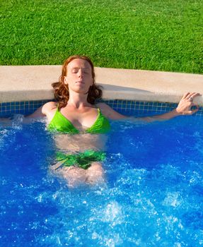 Day spa outdoor woman relaxed on blue pool water