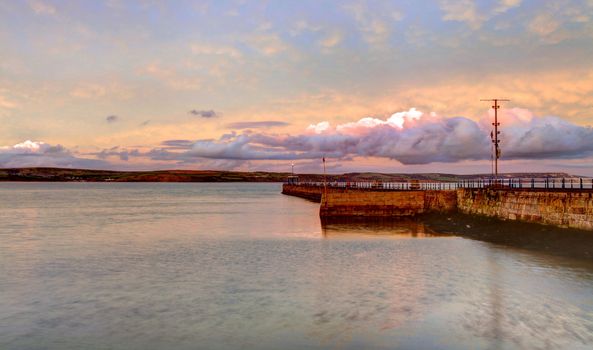 Tranquil sea at the mouth of weymouth harbour in dorset england