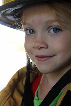 A closeup of a child firefighter