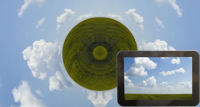 Tab with green farmland and cloudy blue sky