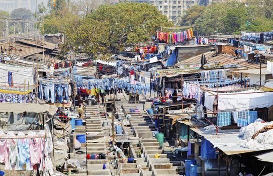 Dhobhi Ghat, Mumbai, India - February 25, 2012: Industrial scene from the viewing gallery at the commercial hand wash laundry in the heart of the city.